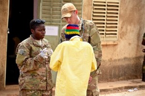 A US Special Operations Command medic and physician go through signs, symptoms, and treatment options with a local man suffering from chronic pain and inflammation