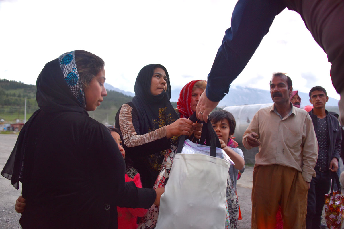 Yazidi families receiving aid