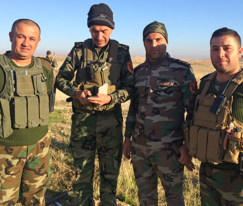 Kurdish Peshmerga commander Captain Dilgash (second from right) at Sinjar, Iraq