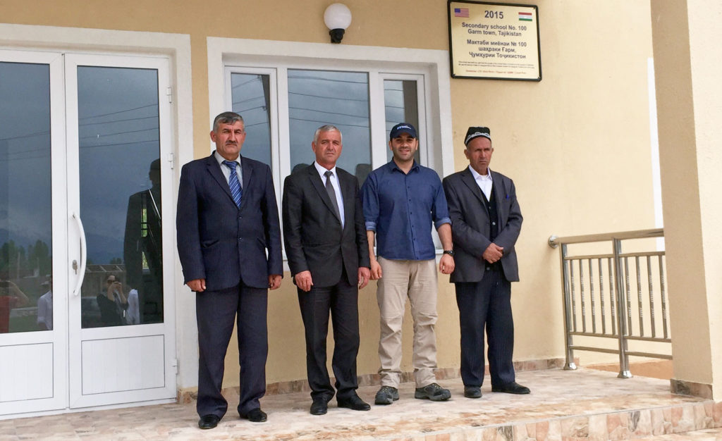 SoA Middle East Field Operations Project Manager, Zack Bazzi, and Gharm District officials in front of the newly built school
