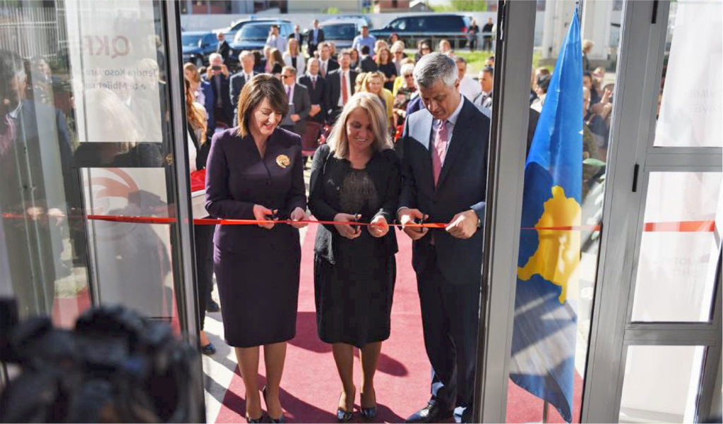 Outgoing Kosovo President Jahjaga (left) and newly elected President Thaci (right) cut the ribbon together (photo courtesy US Army)