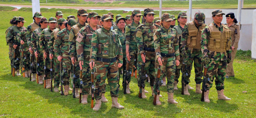 Female Peshmerga fighters line up in formation at their training camp in northern Iraq