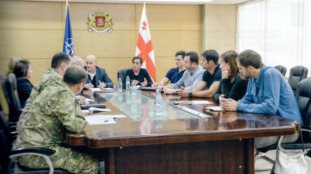 SoA's Isaac Eagan (far right) with CMSE team members at the Georgian Ministry of Defence. (Photo credit: US Army)