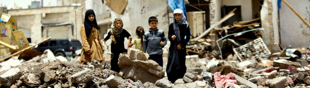 Children standing in rubble from homes destroyed during the current conflict in Yemen. (photo courtesy of AP)