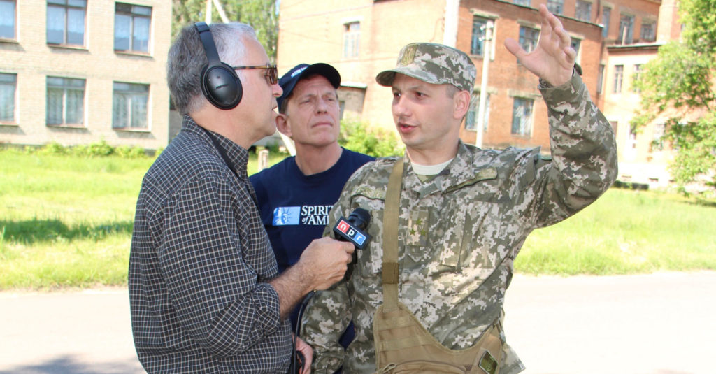 A Ukrainian officer explains the placement of, and security for, one of the radio transmitters provided by Spirit of America.