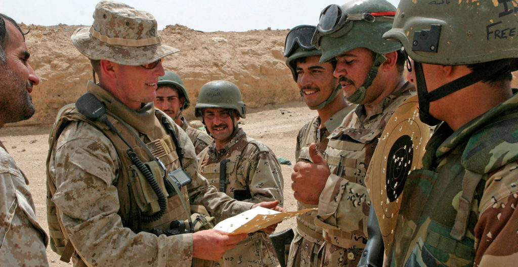 A US Marine and Iraqi troops (Photo courtesy of defense.gov)