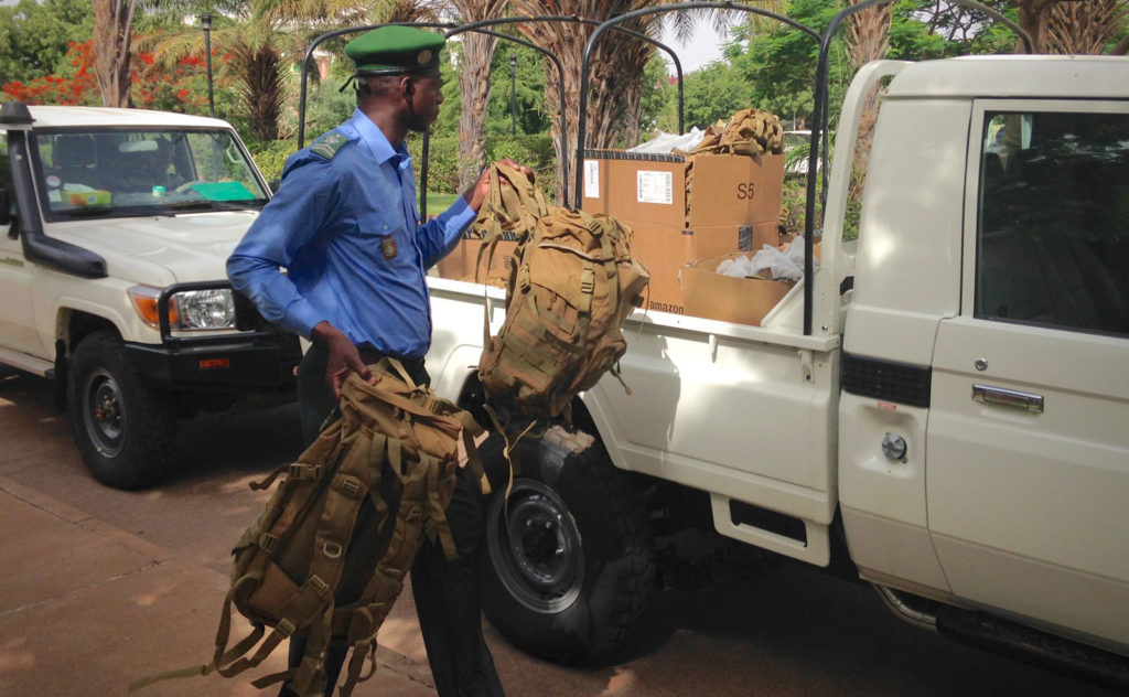 One of the Rangers loads their new equipment into a truck for the long journey back to the Gourma from Bamako.