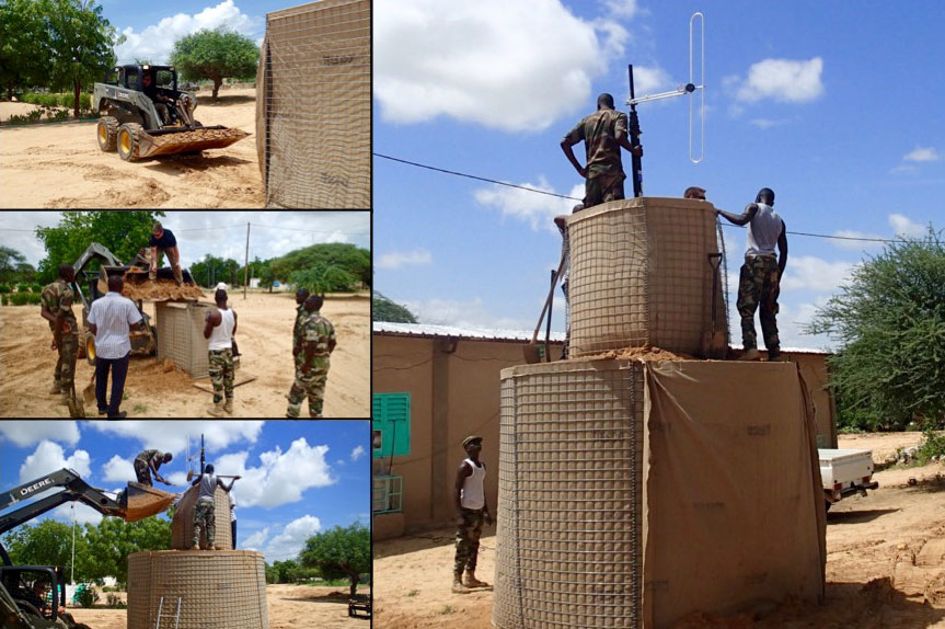 Members of the FAN and their US Advisors work to construct the radio broadcast antenna at the Headquarters of “Radio Bouclier” – in English, “Radio Shield” – in Diffa, Niger