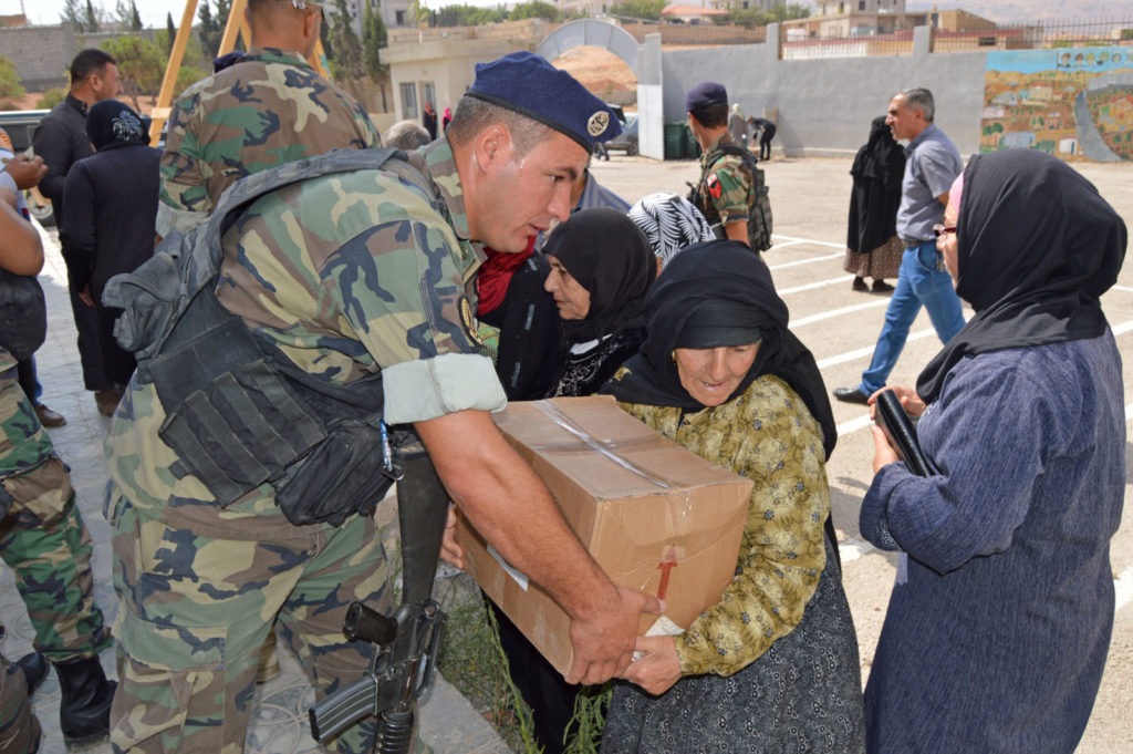 Lebanese Army soldiers distributing SoA-funded food supplies to Lebanese families.