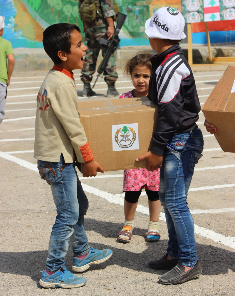 Lebanese children delivering food supplies to their homes.