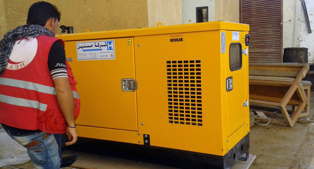 Hospital staff operating the SoA-provided generator