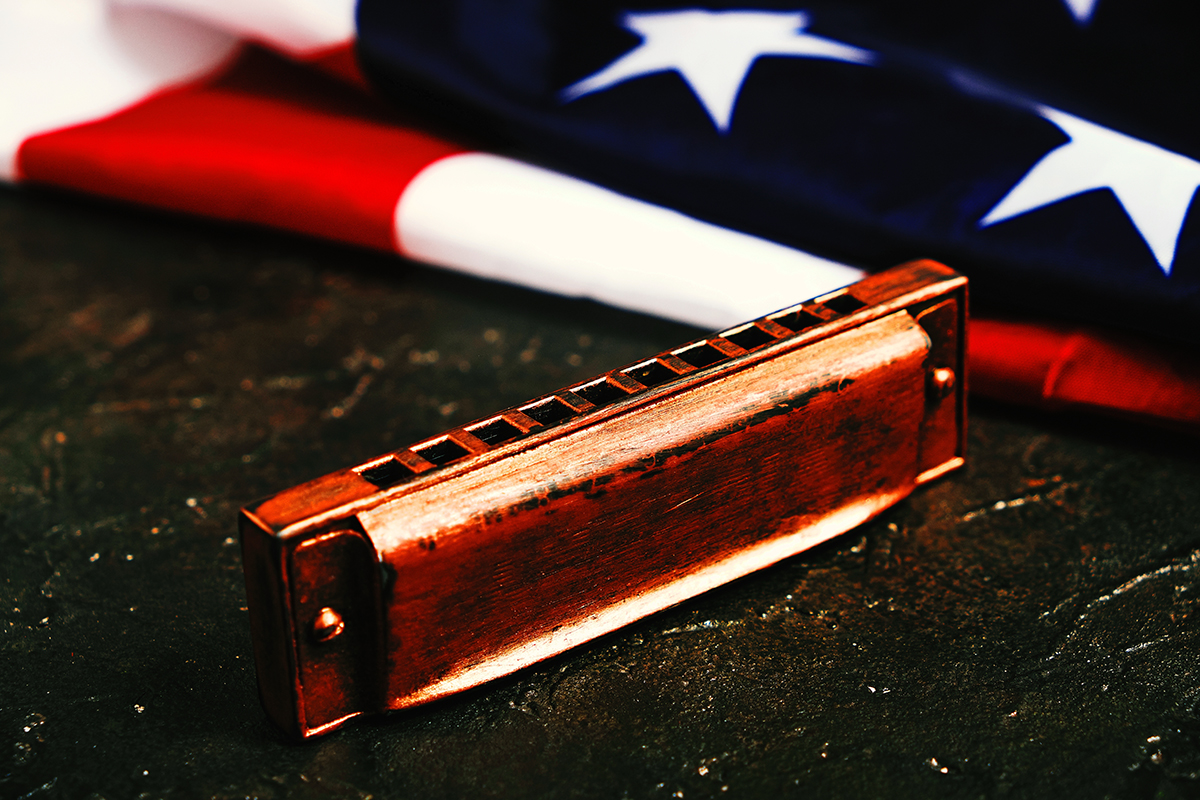 Harmonica on the background of the flag of the United States of America